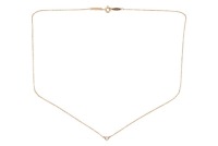 Tiffany & Co. - A 'Diamonds by the Yard' necklace in 18ct yellow gold, designed by Elsa Peretti, set with one round brilliant-cut diamond weighing 0.05ct, in a spectacle setting on a fine cable link chain, completed with spring-ring clasp, signed, London 