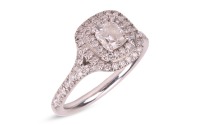 Tiffany & Co. - a 'Tiffany Soleste' double row ring, claw-set with one cushion modified brilliant-cut diamond weighing 0.45ct, surrounded by and set on the shank with bead-set round brilliant-cut diamonds weighing approximately 0.32ct total, in white meta