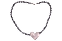 Georg Jensen &ndash; A heart pendant on a hematite bead necklace, designed by Allan Scharff, comprising a stylised heart pendant threaded onto a necklace of hematite beads, each measuring 7.3mm in diameter, completed with a lobster clasp, the heart pendant stam