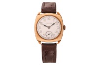 Longines &ndash; A 9ct Gold Dress Watch Reference: 86037 (Case marked &lsquo;6037&rsquo;) Serial: 6446114 (To Movement) Year: Hallmarked Birmingham 1942 Bezel: Smooth Case Material: 9ct Yellow Gold Case Diameter: Approximately 30mm x 30mm Dial: White Porcelain, Blued Plume
