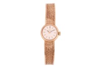 Omega &ndash; A 9ct Gold Dress Watch Reference: 9945655 Serial: 32300173 (To Movement) Year: Hallmarked Birmingham 1964 Bezel: Smooth Case Material: 9ct Gold Case Diameter: Approximately 16mm Dial: Silvered, Brushed, Pointed Baton Hands Numerals: Baton Crown: S