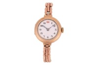 A 9ct Gold Dress Watch Reference: 64348 Year: Hallmarked London 1920 Bezel: Smooth Case Material: 9ct Yellow Gold Case Diameter: Approximately 25mm Dial: White Enamel, Breguet Hands Numerals: Black Arabic, Red Arabic at twelve o&rsquo;clock, Minute Track Crown: