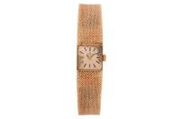 Tissot &ndash; A 9ct Gold Wristwatch Reference: 1061 / 78400 Serial: 16492367 Year: Hallmarked Birmingham 1973 Bezel: Smooth Case Material: 9ct Yellow Gold Case Diameter: Approximately 14mm x 14mm Dial: Cream, Silvered, Sunburst, Pointed Baton Hands Numerals: B