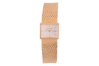 Movado &ndash; An &lsquo;18Kt&rsquo; Dress Watch Bezel: Smooth Case Material: &lsquo;18Kt&rsquo; Case Diameter: Approximately 16mm x 13mm Dial: Silvered, Brushed, Pointed Baton Hands Numerals: Baton Crown: To Case Back, Fluted Movement: Manual Wind Strap: Integral Mesh Strap with Cros
