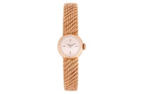 Omega &ndash; An 18ct Yellow Gold Dress Watch Reference: 7049 Serial: 510877 Year: London Import Marks 1962 Bezel: Smooth Case Material: 18ct Yellow Gold Case Diameter: Approximately 18mm Dial: Silvered, Brushed, Pointed Baton Hands Numerals: Baton Crown: Signe