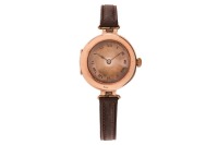 Rolex &ndash; A 9ct Gold Trench-Style Wristwatch Reference: 1081365 Serial: 2828 Year: London Import mark, dated 1919 Bezel: Smooth Case Material: 9ct Gold (Outer surfaces rose-toned, inside of case yellow-toned) Case Diameter: Approximately 27mm Dial: Silvered