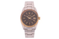Rolex &ndash; An Oyster Perpetual Datejust Reference: 6605 Serial: 279349 Year: Early 1940s Bezel: Fluted Case Material: Bi-Metal Case Diameter: Approximately 36mm Dial: Black Numerals: Baton, Minute Track, Rolex Coronet at twelve o&rsquo;clock Crown: Rolex Twinlock 