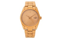 Rolex &ndash; An Electroplated Oyster Perpetual Date Reference: 15505 Serial: 8692894 Year: 1984 Bezel: Smooth Case Material: Electroplated Stainless Steel Case Diameter: Approximately 44mm Dial: Gold-Tone, Sunburst, Baton Hands Numerals: Baton, Rolex Coronet a