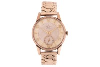 Smiths &ndash; A 9ct Yellow Gold Wristwatch Reference: 84226 Serial: C447205 (To Movement) Year: Hallmarked Edinburgh 1957 Bezel: Smooth Case Material: 9ct Yellow Gold Case Diameter: Approximately 32mm Dial: Silvered, Cream Numerals: Arabic Even Numerals, Baton