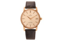 Omega &ndash; A 9ct Yellow Gold Dress Watch Reference: 165/6-5003 Serial: 447820 Year: Hallmarked Birmingham 1966 Bezel: Smooth Case Material: 9ct Yellow Gold Case Diameter: Approximately 34mm Dial: Champagne, Sunburst, Dauphine Hands Numerals: Baton, Minute Tr