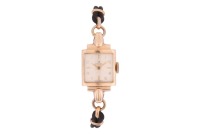 Omega &ndash; A Lady&rsquo;s 9ct Gold Dress Watch Reference: 52964 Serial: 365191 Year: Hallmarked Birmingham 1950 Bezel: Smooth Case Material: 9ct Yellow Gold Case Diameter: Approximately 15mm x 21mm Dial: Silvered, Leaf Hands Numerals: Arabic, Baton at Twelve, Thre