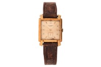 Universal Geneve &ndash; An &lsquo;18K&rsquo; Dress Watch Reference: 109.225 Serial: 1126288 Bezel: Smooth Case Material: &lsquo;18K&rsquo; (Case stamped with Swiss Helvetia Head stamp indicating 18ct) Case Diameter: Approximately 28mm x 28mm Dial: Gold-Tone, Silvered, Pointed Baton H