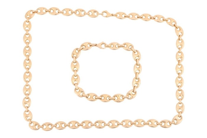 A heavy anchor link necklace and a matching bracelet; fastened with lobster clasp, marked '750', link width 8.8 mm, measuring 51.0 cm and 21.0 cm in length respectively, total weight of item 107.69 grams. (2)