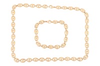 A heavy anchor link necklace and a matching bracelet; fastened with lobster clasp, marked '750', link width 8.8 mm, measuring 51.0 cm and 21.0 cm in length respectively, total weight of item 107.69 grams. (2)