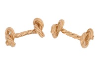 A pair of 'Marine knot' cufflinks in 18ct yellow gold, textured and terminated with nautical rope knot motifs, partial British hallmarks, overall measures 2.5 cm wide, the total weight of items 14.29 grams.