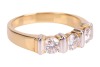 A diamond three-stone dress ring, with an estimated total diamond weight of 0.87ct, comprising three round brilliant-cut diamonds of 4.3mm, in a two-toned bar setting, leading to a tapering flat shank, Italian assay marks '750', size Q, 5.6 grams. - 4