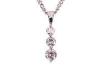 A three-stone diamond pendant, claw-set with three round brilliant diamonds of graduated sizes, with an estimated total diamond carat weight of 0.50ct, in a 9ct white gold mount, to a 9ct gold flat curb link chain, measuring approximately 46cm; 3.6 grams