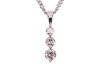 A three-stone diamond pendant, claw-set with three round brilliant diamonds of graduated sizes, with an estimated total diamond carat weight of 0.50ct, in a 9ct white gold mount, to a 9ct gold flat curb link chain, measuring approximately 46cm; 3.6 grams