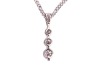 A three-stone diamond pendant, claw-set with three round brilliant diamonds of graduated sizes, with an estimated total diamond carat weight of 0.50ct, in a 9ct white gold mount, to a 9ct gold flat curb link chain, measuring approximately 46cm; 3.6 grams - 3