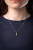 A three-stone diamond pendant, claw-set with three round brilliant diamonds of graduated sizes, with an estimated total diamond carat weight of 0.50ct, in a 9ct white gold mount, to a 9ct gold flat curb link chain, measuring approximately 46cm; 3.6 grams - 4