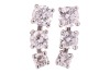 A pair of diamond-set stud earrings, each consisting of three graduated round brilliant-cut diamonds, with an estimated total weight of 1.00ct for the pair, ear post fittings, butterfly backs deficient, unmarked white metal surface testing as 18ct, 1.3 cm