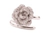 A diamond-set floral ring by Renu Oberoi, featuring a rose form, fully grain-set with round brilliant-cut diamonds, to an open white metal ring shank of bypass design, the shank with segmented detail, marked &lsquo;750&rsquo;, size L, boxed, 7.0 grams. - 2
