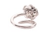 A diamond-set floral ring by Renu Oberoi, featuring a rose form, fully grain-set with round brilliant-cut diamonds, to an open white metal ring shank of bypass design, the shank with segmented detail, marked &lsquo;750&rsquo;, size L, boxed, 7.0 grams. - 5