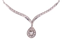 A diamond-set necklace, composed of a V-shaped bar, with diamond-set chevron detailing, suspending a pear-shaped diamond-set pendant, to a box-link chain measuring approximately 42cm, in white metal stamped &lsquo;585&rsquo;; 8.4 grams