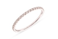 A diamond eternity ring, featuring forty round brilliant-cut diamonds, with an estimated total carat weight of 0.72ct, claw-set in white metal marked &lsquo;18K&rsquo;, size T, 1.0 grams.