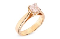 A diamond solitaire ring, featuring a central claw-set princess-cut diamond of estimated 0.44ct, to tapered shoulders leading to a yellow metal ring shank marked &lsquo;750&rsquo;, size H &frac12;, 4.2 grams.