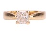 A diamond solitaire ring, featuring a central claw-set princess-cut diamond of estimated 0.44ct, to tapered shoulders leading to a yellow metal ring shank marked &lsquo;750&rsquo;, size H &frac12;, 4.2 grams. - 2