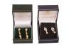 Two pairs of earrings; comprising a pair of paste-set earrings, of stylised foliate design, in 18ct gold mounts, with screw backs, together with a pair of faceted bead drop earrings, in yellow metal surface tested as 18ct; 5.7 grams (2) Please note: Unles - 2