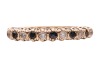 A sapphire and paste-set half-hoop ring, claw-set in an alternating pattern, to a 9ct gold mount, size Q; 1.8 grams - 2