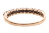 A sapphire and paste-set half-hoop ring, claw-set in an alternating pattern, to a 9ct gold mount, size Q; 1.8 grams - 3