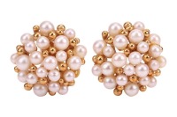 A pair of cultured pearl cluster earrings, the slightly domed earrings closely-set with cultured pearls and gold beads of graduated sizes, with one pearl deficit, to an 18ct yellow gold mount with hinged ear clips, stamped with London import marks, 1988, 
