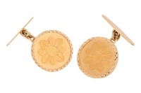 A pair of coin-mounted cufflinks, each set with a coin with lotus motif on the obverse inscribed '24ct fine gold / 4 grams', relief of Goddess Lakshmi to the reverse, within a bright-cut surround to fittings marked '18ct', total weight 14.76 grams.