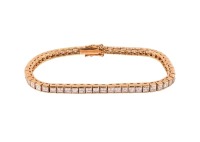 A diamond line bracelet, with an estimated total diamond weight of 9.35ct, comprising a series of carre-cut diamonds in articulated channel mounts, completed with a conforming box clasp, yellow metal stamped '750', overall length 18.0 cm, 18.3 grams. each