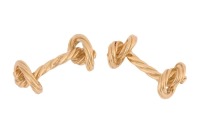 A pair of 'Marine knot' cufflinks in 18ct yellow gold, textured and terminated with nautical rope knot motifs, partial British hallmarks, overall measures 2.5 cm wide, the total weight of items 13.95 grams.
