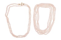 Two opera-length cultured pearl necklaces; the first featuring oval-shaped cultured pearls of approximately 9.0 x 7.75 mm each, of cream body colour with silver pink lustre, length approximately 332 cm; the second featuring off round, oval and teardrop sh
