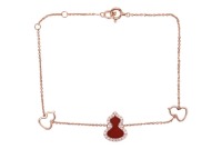 A Qeelin 'Wulu' bracelet set with carnelian and diamonds, featuring Chinese Hulu gourd motifs, set with an agate panel and diamond accents, signed and numbered, in pink metal stamped 'Au750', overall length 18.0 cm, 2.2 grams.