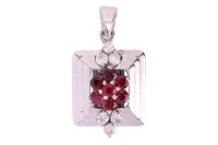 A gem-set cluster pendant, claw-set with round-cut rubies and round brilliant diamonds in a floral design, to a stepped square-shaped pendant mount, in white metal marked &lsquo;585&rsquo;; 4.1 grams