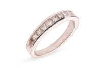 A princess-cut diamond half eternity ring, with an estimated total diamond weight of 0.66ct, comprising eleven princess-cut diamonds in a channel setting, to a tapering shank in white metal marked '14K', size Q, 4.5 grams. Approximate colour and clarity g