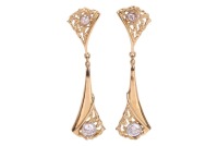 A pair of diamond-set drop earrings, of abstract design, each collet-set with a 4.5 mm round brilliant-cut diamond and a 2.5 mm diamond to the surmount, with an estimated total weight of 0.77ct for the pair, 4.9 cm drop, yellow metal testing as 18ct, 7.67