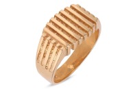 A signet ring with parallel ridged decoration, to a tapering flat shank stamped '18ct', size V, 9.14 grams.