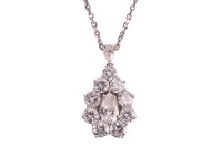 A diamond cluster pendant on chain, with an estimated total diamond weight of 3.00ct, the teardrop cluster centred with a pear-cut diamond, surrounded by graduated round brilliant-cut diamonds, and on a bail set with a marquise-cut diamond, 2.4 cm drop le