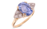 An unheated colour-change Ceylon sapphire solitaire ring, featuring an oval-cut sapphire of medium purplish-blue colour, measuring 12.2mm x 8.4mm x 8.0mm, with an estimated carat weight of 7.61ct, claw-set between triangular shoulders set with diamond acc