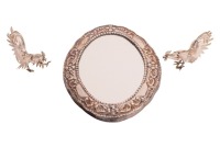 A pair of 20th-century (951) white metal hollow fighting cocks with engraved plumage, marked &ldquo;951&rdquo;, 9 cm long, and a "Sterling" silver faced oval table mirror with embossed scrolls and wooden base, 19 cm long, 43.0 grams of weighable silver, just the figh