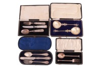 A David Anderson of Norway white metal three-piece Christening set of knife, fork and spoon cast with fox, bear and rabbit, a pair of early 20th century cast silver appostle (St.James) spoons, a cased "Doric" fork and spoon set, and a Victorian cased silv