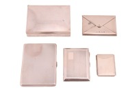 A small agglomeration of silver items; including a Tiffany & Co. of New York, folding triptych photograph frame, 13 cm long open, two heavy silver cigarette cases and a silver presentation cigarette box bearing a plaque inscribed from TAC Wolde-Selassie a