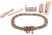 An Ottoman/Albanian filigree white metal Kollan lady's belt with a tasselled bow-shaped clasp, each link shaped from individual filigree panels, probably late 19th century, see the example held in the collection of the British Museum for a comparative cla